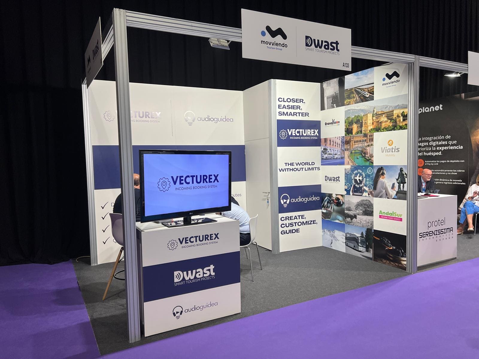 Professional promotional exhibition booth representing Movviendo and Dwast brands with information panels during an international tourism trade fair.